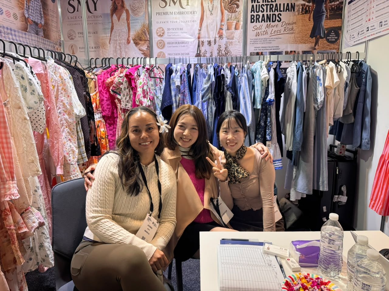 SMY team with a visitor at the Sydney fashion exhibition